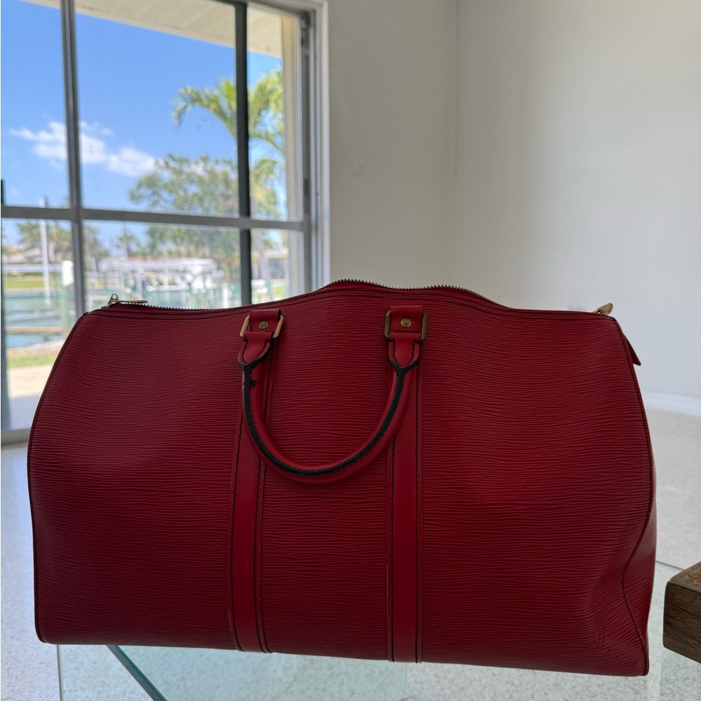 Red Louis Vuitton Duffle Bag